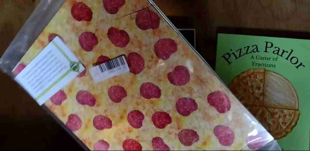 Pizza Parlor fraction game comes with a resealable bag