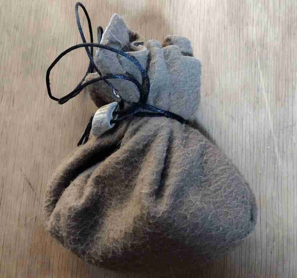 Hnefatafl game board as a bag for pieces