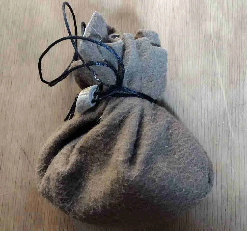 Hnefatafl game board as a bag for pieces